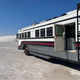 Image for article titled This Wild School Bus RV Has Underglow And A Fire Pit On Its Roof